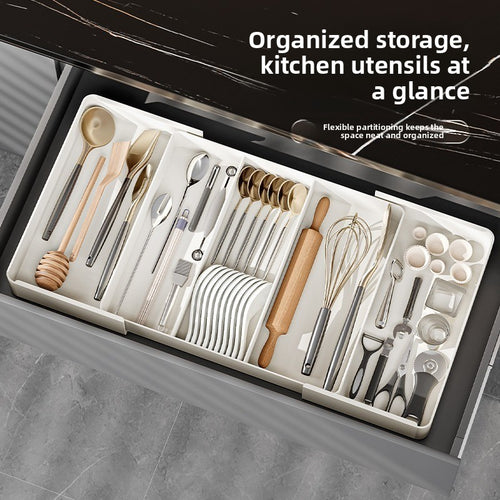 Nexora Plus organizer tray installed inside an open kitchen drawer with utensils neatly separated